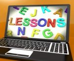 Lessons Message On Computer Screen Showing Online Education Stock Photo