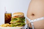 Junk Food And Big Fat Stomach Stock Photo