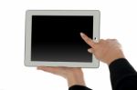 Female Finger Pointing At Blank Screen Of Tablet Pc Stock Photo