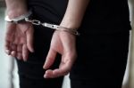 Criminal In Handcuffs Arrested For Crimes Stock Photo