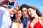 Group Of Young Friends Standing Together Taking A Self Portrait Stock Photo