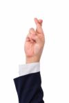 Business Man Finger Crossed Hand Sign Stock Photo