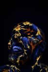 Man's  Face Painted In Neon Uv Lava Stock Photo