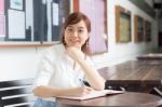 Portrait Of Thai Adult Businesswoman Beautiful Girl Write A Book Stock Photo