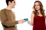 Boyfriend Handing Over Credit Card Stock Photo