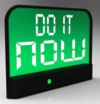 Do It  Now Clock Showing Urgency For Action Stock Photo
