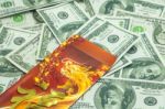 Chinese New Year Dragon Red Envelope And Dollars Stock Photo