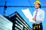 Construction Worker Reviewing Blueprint Stock Photo