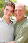 Image Of Portrait Of A Happy Senior Man With Grandson Stock Photo