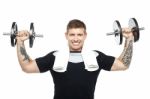 Young Bodybuilder Exercising, Toning His Biceps Stock Photo