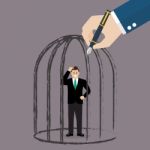 Businessman Standing In A Hand Drawn Cage Stock Photo