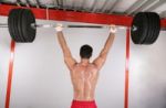 Young Bodybuilder Training In Gym.  Focus In The Body Stock Photo