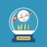 Merry Christmas Glass Ball With Santa Sleigh And Winter House Stock Photo