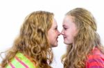 Two Dutch Teenage Girls Noses Make Contact Stock Photo