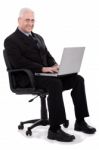 Busy Senior Business Man Sitting In Chair Stock Photo