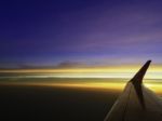 Beautiful Twilight Cloud Sky Through Airplane Wing Stock Photo
