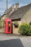 Defibrillator In And Old Phone Box In Upper Slaughter Village Stock Photo