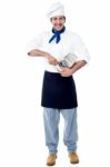 Isolated Chef Posing With Utensil Stock Photo