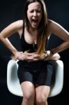 Young Woman In A Chair Caught By A Male Arms. Concept Of Oppress Stock Photo