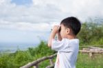 Little Child Look In Binoculars Outdoor In Sunny Summer Day Stock Photo