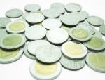 Group Of Thai Baht Coins On White Table Background Stock Photo