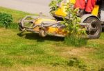 Man Mows A Lawn Mower Stock Photo