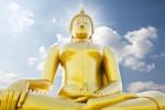 Big Golden Buddha Statue Against Sky Stock Photo