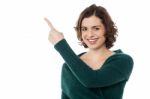 Charming Woman Pointing Towards Copy Space Area Stock Photo