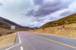 Asphalt Road High Way Empty Curved Road Clouds, Sky And Mountain Stock Photo