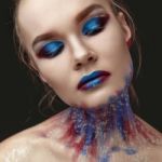 Portrait Of Beautiful Girl With Blue Tones Makeup Stock Photo