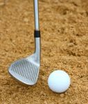 Hitting A Golf Ball Out Of A Bunker Stock Photo