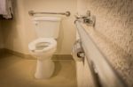Disabled Toilet Bathroom With Grab Bars In White Interior Design Hotel Stock Photo