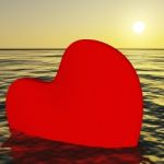 Heart Sinking Into Sea Stock Photo