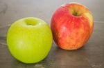 Green And Red Apple On The Table Stock Photo