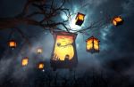 Halloween Caged Candles Hanging On Branch Of The Tree Stock Photo