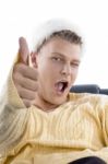 Male Winking And Showing Thumbs Up Stock Photo