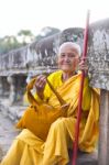 An Unidentified Old Buddhist Female Monk Dressed In Orange Toga Stock Photo