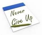 Never Give Up Notebook Means Determination And Motivation Stock Photo