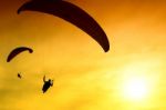 Silhouette Of Parachute On Sunset Stock Photo