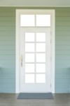 Vintage White Door On The Green Wall Stock Photo