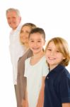 Young Grandmother And Grandfather With Nephew And Niece Standing Stock Photo