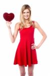 Pretty Young Girl Holding Heart Shaped Gift Stock Photo