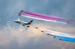 Virgin Atlantic - Boeing 747-400 And Red Arrows Aerial Display A Stock Photo