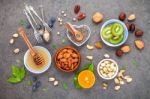 Ingredients For A Healthy Foods Background, Nuts, Honey, Berries Stock Photo