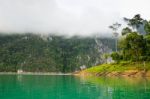 Beautiful High Mountains And Green Lake Stock Photo