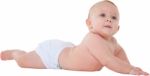 Cute Baby Boy Looking Away While Lying Down Stock Photo