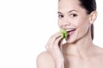 Happy Beauty Woman Eating Spinach Stock Photo