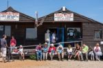 People Enjoying Fish And Chips In Southwold Stock Photo