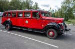 Red Bus In Glacier National Park Montana Stock Photo