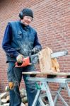 Man Working With Chain Saw Stock Photo